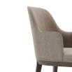 A sophisticated and stylish chair by Domkapa with a luxury upholstery and dark wooden frame