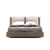 A luxurious super king contemporary bed with a cushioned headrest and brushed rose gold detailing