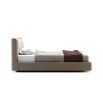 A luxurious super king contemporary bed with a cushioned headrest and brushed rose gold detailing