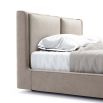 A luxurious super king contemporary bed with a cushioned headrest and brushed rose gold detailing