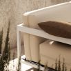 Modern outdoor armchair with steel frame and off white upholstery