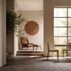 A stylish boucle ottoman with walnut stained ash legs 