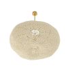Large rattan style ceiling light with brass fixture to the ceiling