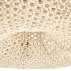 Large rattan style ceiling light with brass fixture to the ceiling