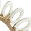 Playful pendant fashioned with clear glass hoops and exposed bulbs that surround a circular framework of antique brass iron