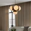 5 orb cluster chandelier with ribbed brass details and spherical shades