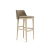 A luxurious bar stool featured in a weave upholstery with a natural ash finish and gold brushed stainless steel accents