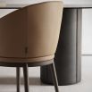 A luxury dining chair by Domkapa with a sophisticated upholstery