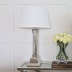 Nickel column table lamp with white shade