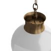 Round white orb light with chain tassel at the base in brass