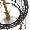 Black rattan pendant light with curvaceous silhouette and brass drop