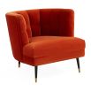 A luxury armchair by Jonathan Adler with a gorgeous red upholstery and beautiful brass capped feet