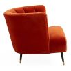 A luxury armchair by Jonathan Adler with a gorgeous red upholstery and beautiful brass capped feet