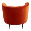 A luxury armchair by Jonathan Adler with a gorgeous red upholstery and beautiful brass capped feet