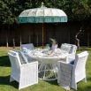 White rattan dining table with glass top