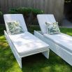 Cream outdoor lounger with foam seat and plastic base