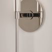 A sophisticated contemporary-style wall sconce in polished nickel with an off white shade