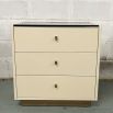 Ivory coloured three drawer bedside table with chocolate coloured details