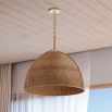 Cone-shaped rattan pendant with gold accents