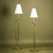 Floor lamp with golden base and white lampshade