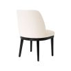 A stylish dining chair with a luxury Pausa Natural upholstery and sophisticated black frame