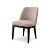 A sophisticated dining chair by Eichholtz with a luxury Mademoiselle Beige upholstery
