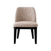 A sophisticated dining chair by Eichholtz with a luxury Mademoiselle Beige upholstery