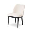 A stylish dining chair with a luxury Pausa Natural upholstery and sophisticated black frame