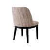 A sophisticated dining chair by Eichholtz with a luxury Mademoiselle Beige upholstery