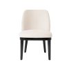 A stylish dining chair with a luxury Pausa Natural upholstery and sophisticated black frame