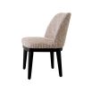 A sophisticated dining chair by Eichholtz with a luxury Mademoiselle Beige upholstery