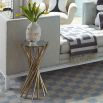 a glamorous nickel and brass table with a mirrored surface 