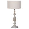 A luxurious natural wood table lamp with a cotton and linen blend shade