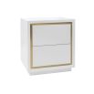 A sleek bedside table by Liang & Eimil with a white finish and brushed brass details