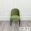 A set of six dining chairs by Laskasas with a green velvet upholstery and elevated on dark, wooden legs with golden caps