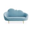 The luxurious sky blue ether cloud sofa by Jonathan Adler with polished brass feet