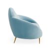 The luxurious sky blue ether cloud sofa by Jonathan Adler with polished brass feet