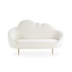 A luxurious cloud-shaped sofa with boucle upholstery and polished brass legs