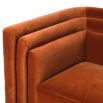 A retro sofa with a luxury orange cotton velvet upholstery and grooved details