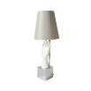 A beautiful hand-shaped table lamp with a grey silk shade and a nickel base