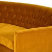 A stunning retro-inspired curved sofa with saffron-coloured upholstery 