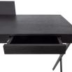 Black sculptural desk with metal legs and wooden table top