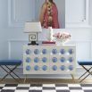 An exquisite bench with blue velvet and black and brass legs