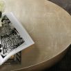 A statement coffee table by Caracole with an organic oval shape