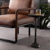 Sculptural black drinks table with cylindrical top