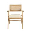 A stylish, Scandinavian-inspired upholstered armchair with a caned back rest