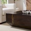 Angular rectangular cocktail table in dark wood finish.
