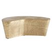 Coffee table in natural, curved silhouette in antique brass finish.