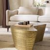 Coffee table in natural, curved silhouette in antique brass finish.