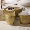 Coffee table in natural, curved silhouette in antique brass finish.